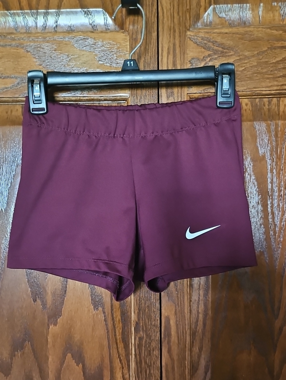Nike Women’s Maroon Athletic Shorts with White Swoosh